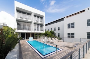 Outdoor pool, open 8:00 AM to 7:00 PM, pool loungers