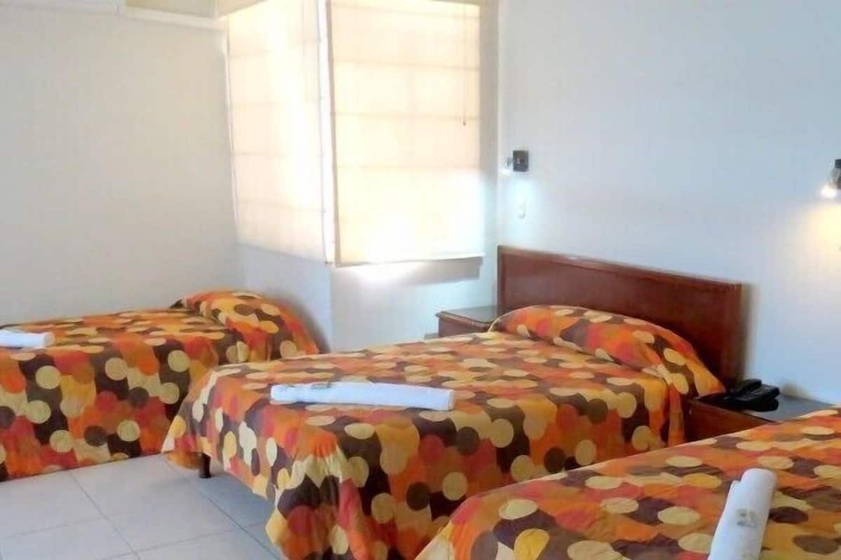 Triple Room | Minibar, in-room safe, desk, cribs (free)