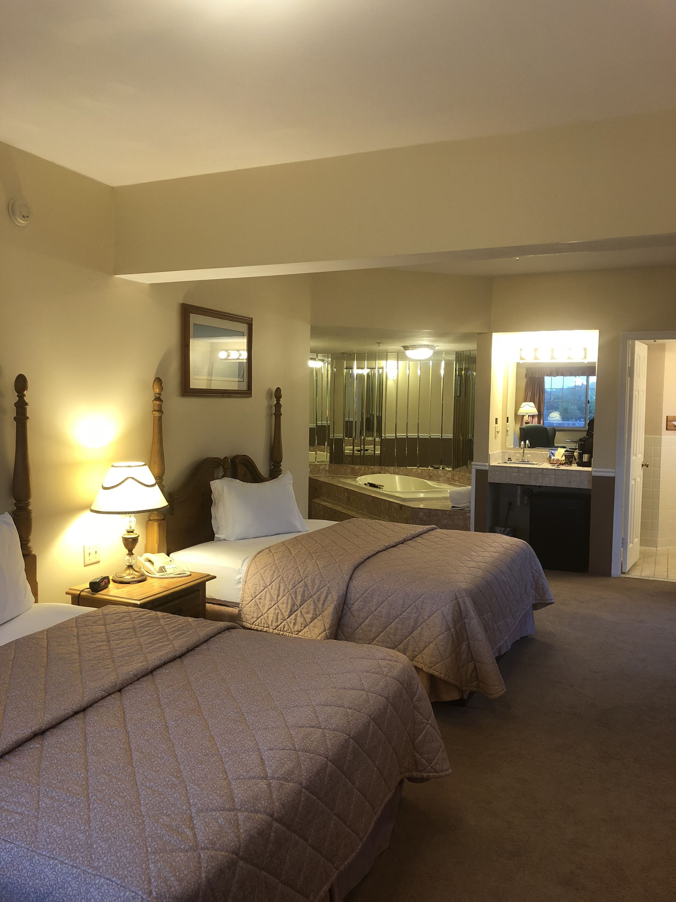 luxury suite, 2 queen beds, jetted tub | 1 bedroom, iron/ironing board, free wifi, bed sheets