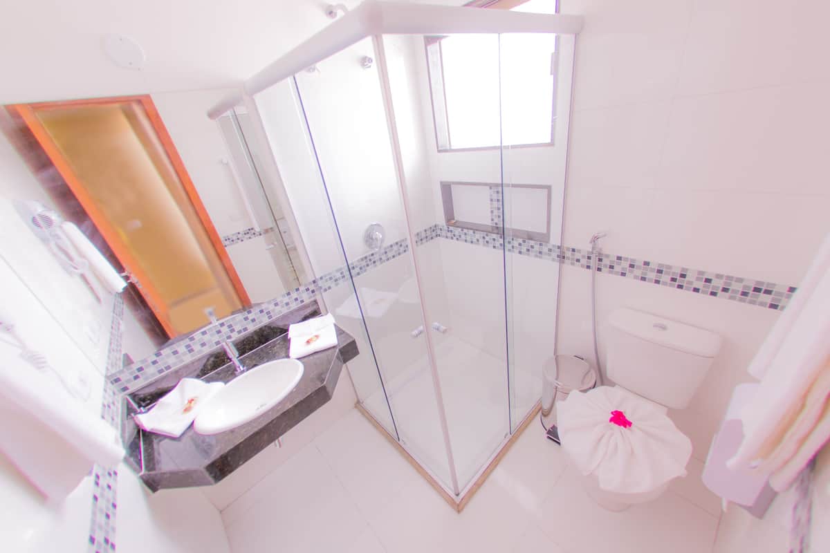 shower, hair dryer, bidet, towels