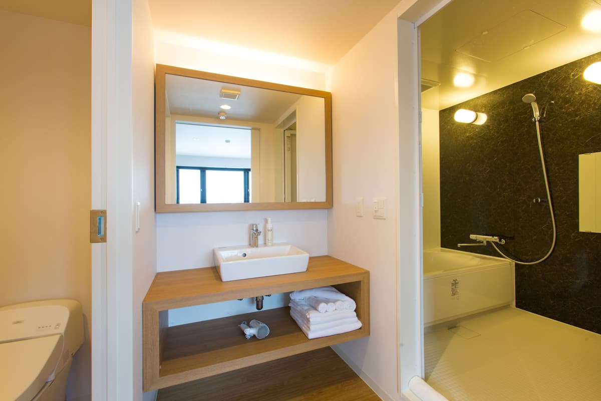 yotei suite | bathroom | combined shower/bathtub, free toiletries, hair dryer, slippers