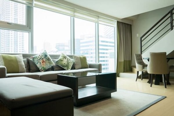 Premier One Bedroom Suite | Living room | Flat-screen TV