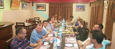 A conference room with a long table set for a meeting.
