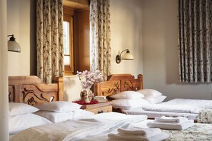 Standard Quadruple Room | Premium bedding, soundproofing, iron/ironing board, bed sheets