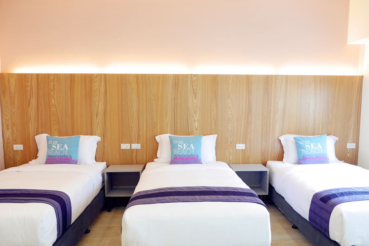 Deluxe Triple Room, 1 Bedroom, Balcony | 1 bedroom, blackout curtains, free WiFi, bed sheets