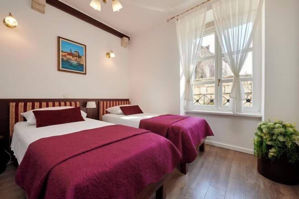 Premium bedding, in-room safe, laptop workspace, soundproofing