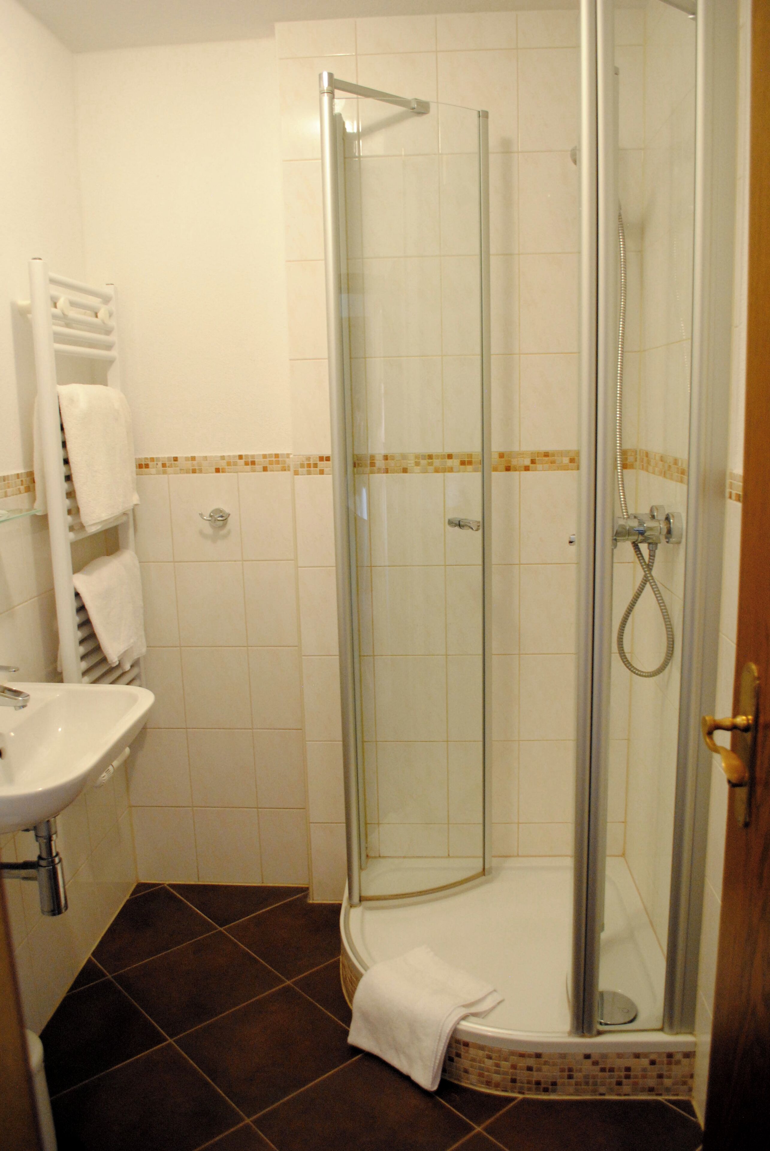 standard double room | bathroom | shower, hair dryer, towels, soap