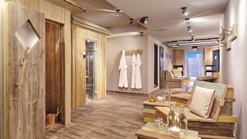 Relax in a serene spa room with a reception desk, seating area, and shower.