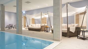 Indoor pool, open 8:00 AM to 10:00 PM, pool loungers
