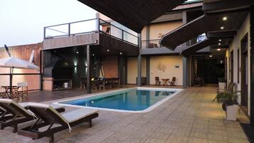 Outdoor pool, pool umbrellas, sun loungers