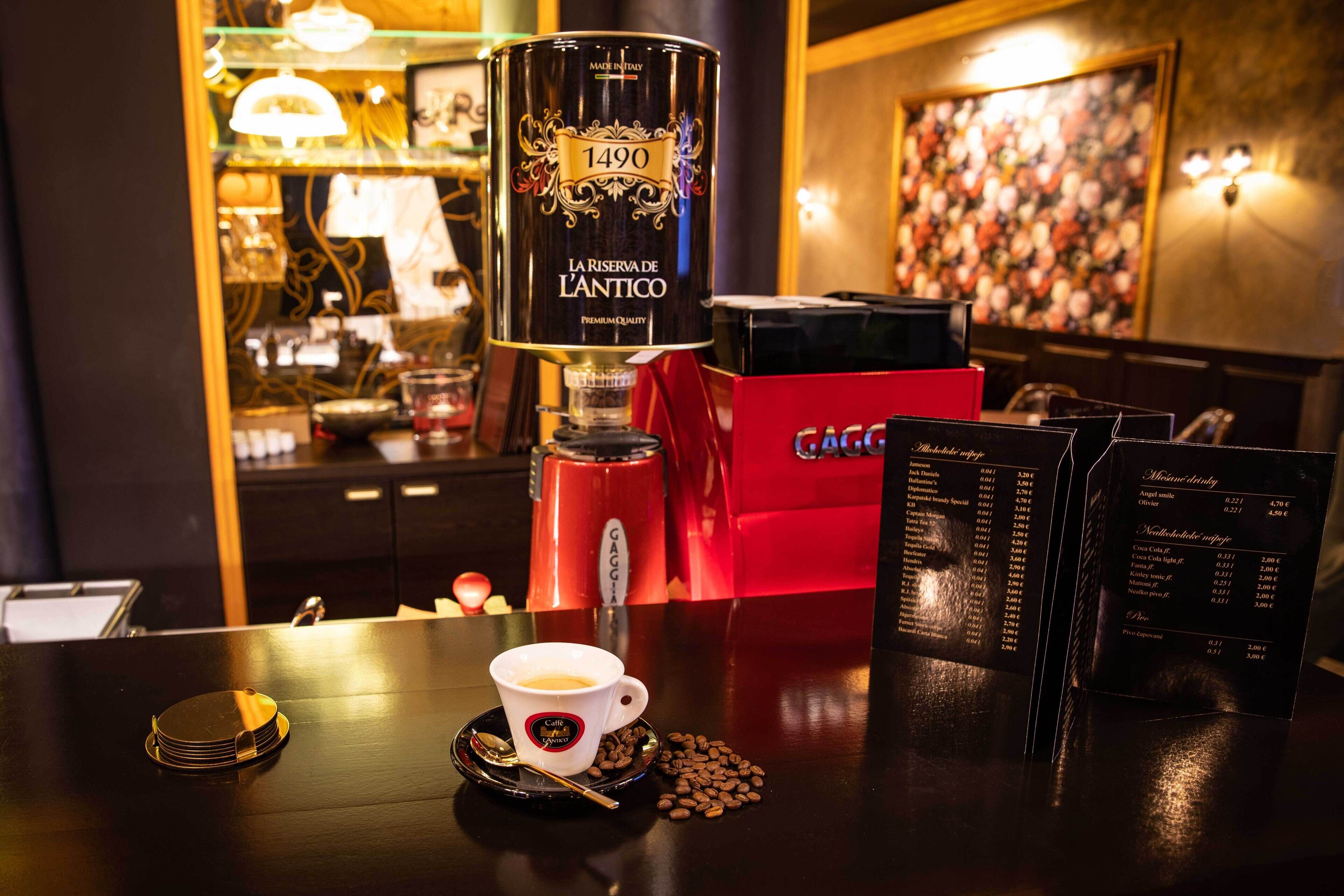 A coffee machine, a cup of coffee, and a menu on a table in a cafe.