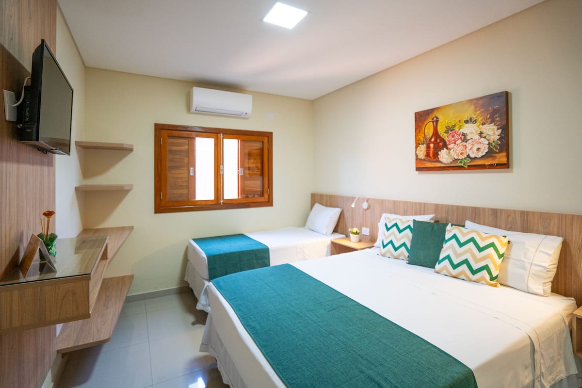 Habitación triple Deluxe | Minibar, wifi gratis y ropa de cama