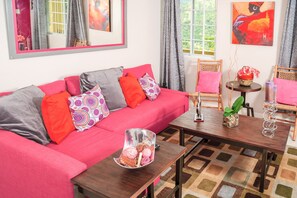 Superior Apartment, 2 Bedrooms, Terrace, Courtyard View | Living room | 50-inch flat-screen TV with cable channels, TV, DVD player - Skyview Manor Guest Apartments (Kingston)