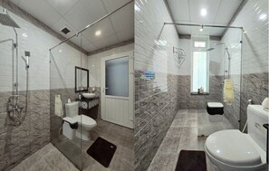 A modern bathroom with a glass-enclosed shower, a toilet, and a sink. - Flamingo Villa Hoi An (Da Nang)