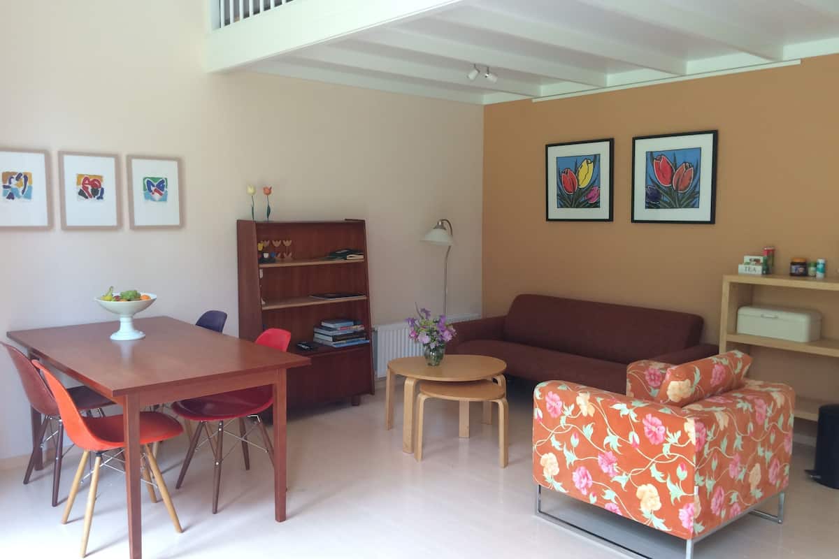 Apartment, 1 Bedroom (De Tulp) | Living area | Flat-screen TV