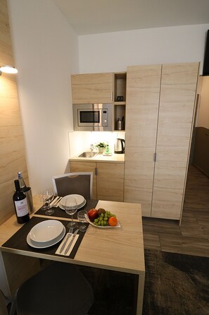 Mini-fridge, microwave, coffee/tea maker, electric kettle
