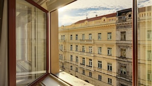 A multi-story building with ornate architectural details and a balcony. - Salvator Boutique Hotel (Prague)