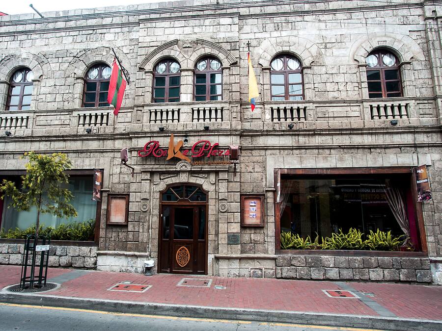 A historic stone building with a sign reading "Roca Plaza Hotel."