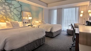 Hypo-allergenic bedding, desk, laptop workspace, blackout drapes