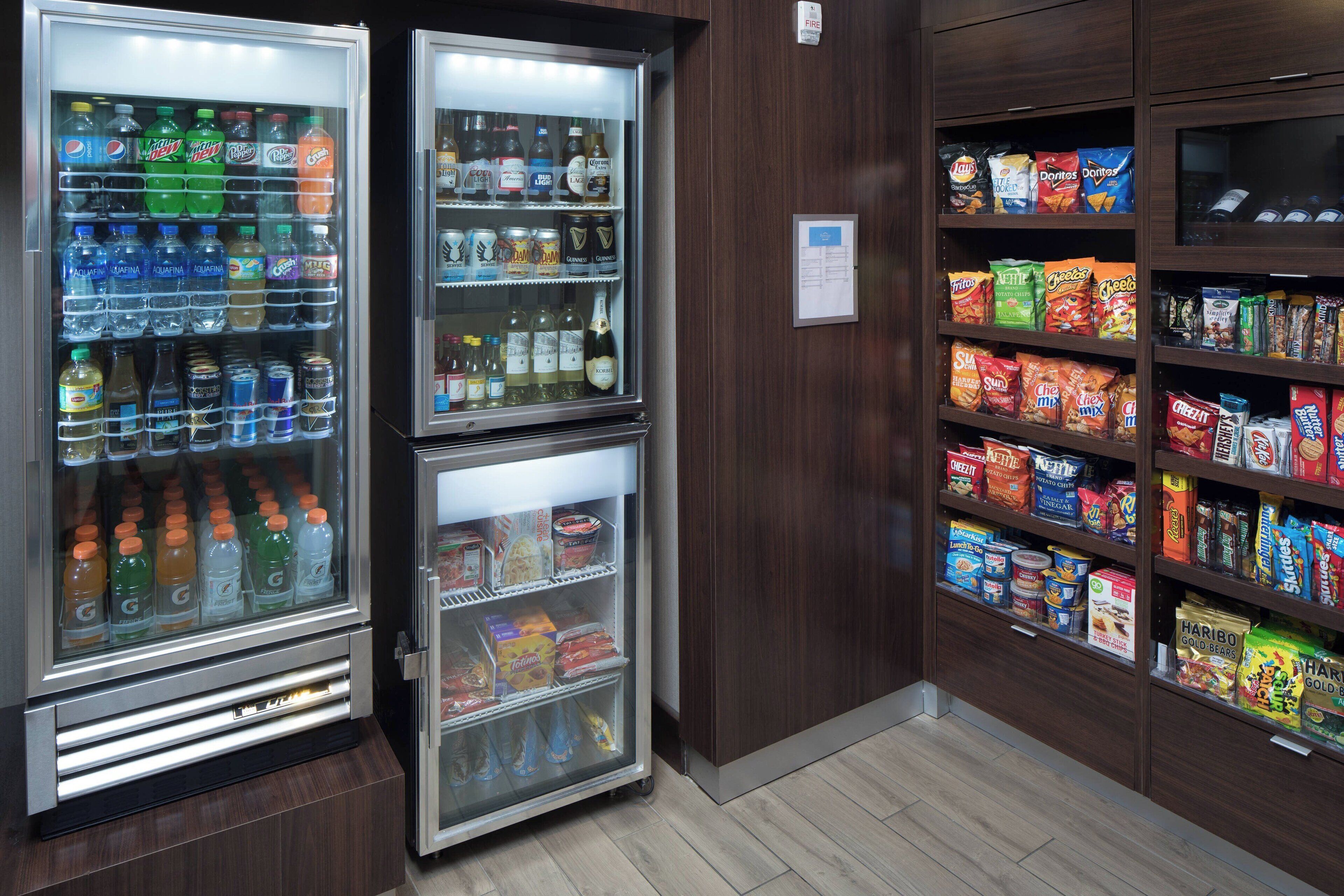 A vending machine area with various drinks and snacks.