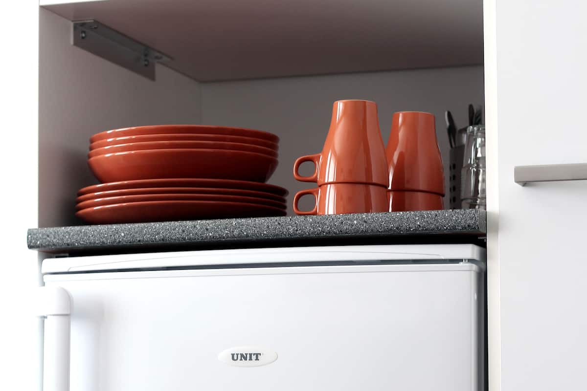 microwave, coffee/tea maker, electric kettle, cookware/dishes/utensils