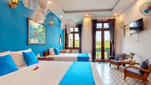 A hotel room with two beds, a TV, a balcony, and a dining area. - Lang Dong An Bang (Da Nang)