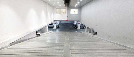 A parking garage with multiple levels and a central ramp.