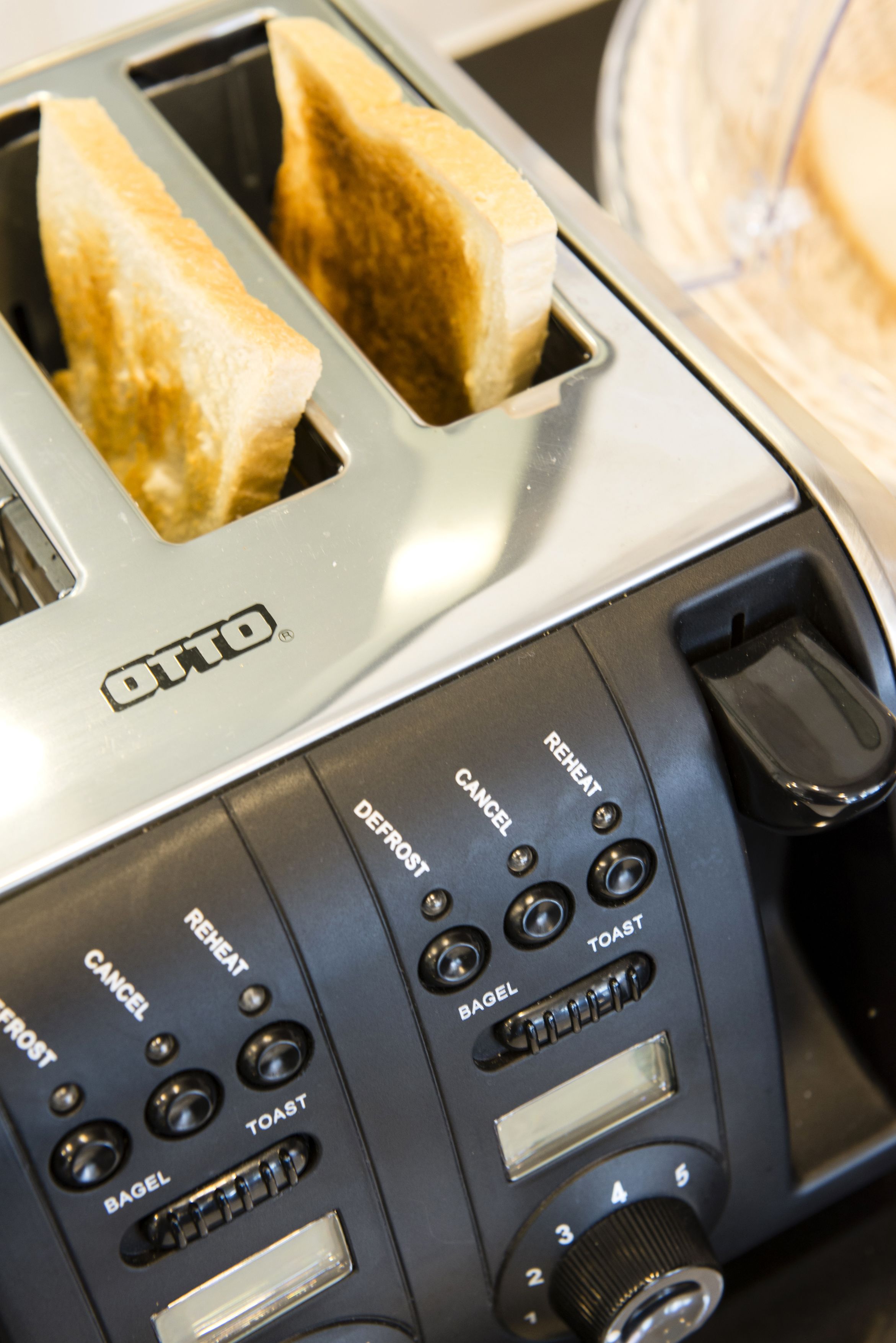 A toaster with multiple settings including bagel, toast, and defrost.