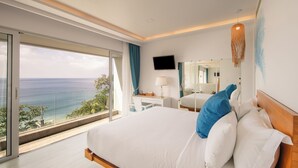 A hotel room with a large bed, a desk, a TV, and a balcony with a view of the ocean. - Bluesiam Villa (Choeng Thale)