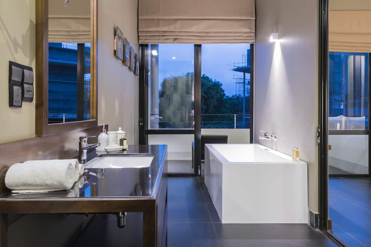 super deluxe double room | bathroom | shower, rainfall showerhead, free toiletries, hair dryer