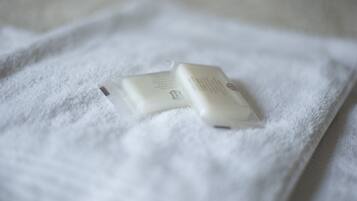 A white towel with a small white object on it.