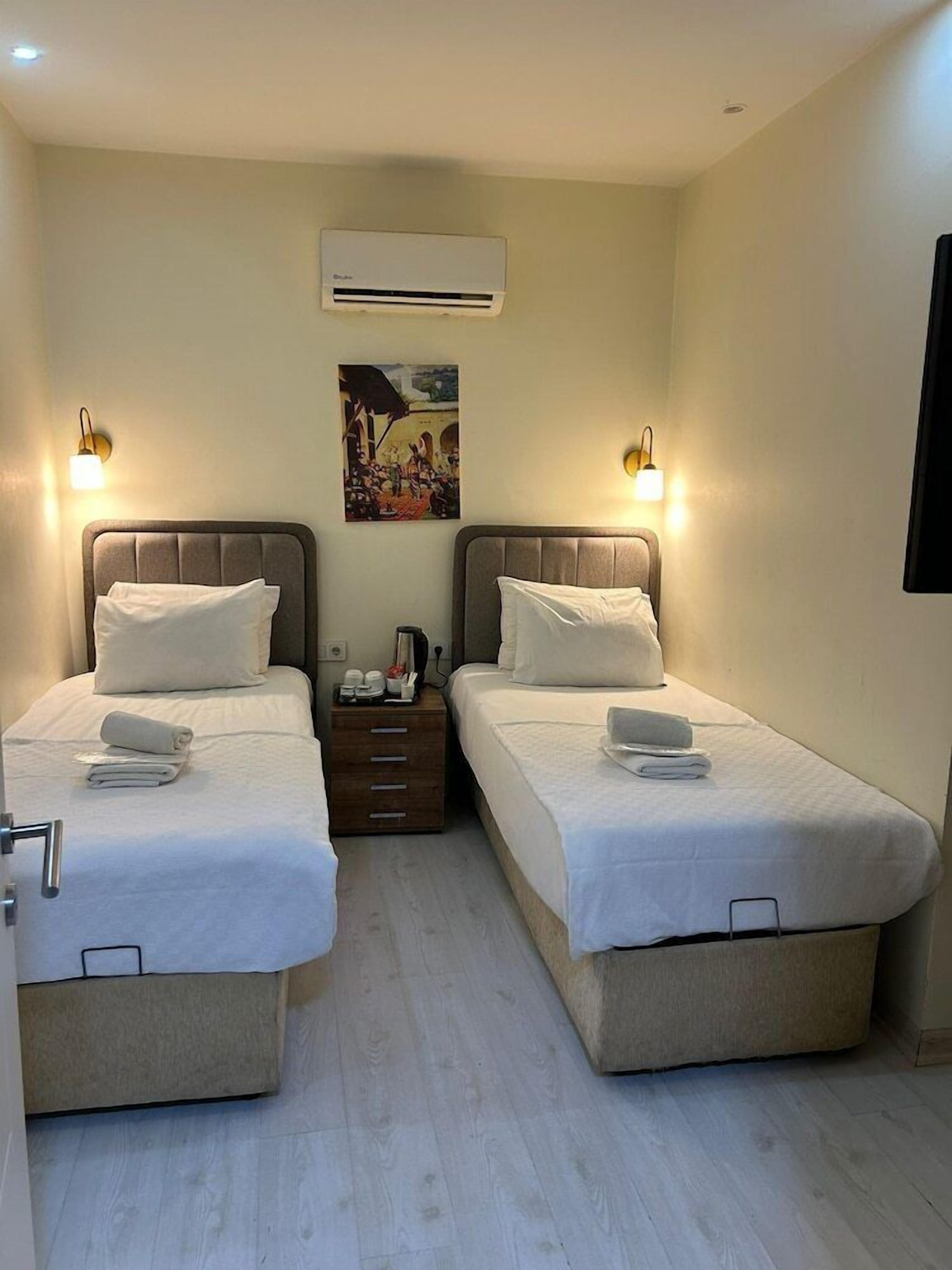 1 quarto, roupas de cama premium, frigobar (abastecido com itens grátis)