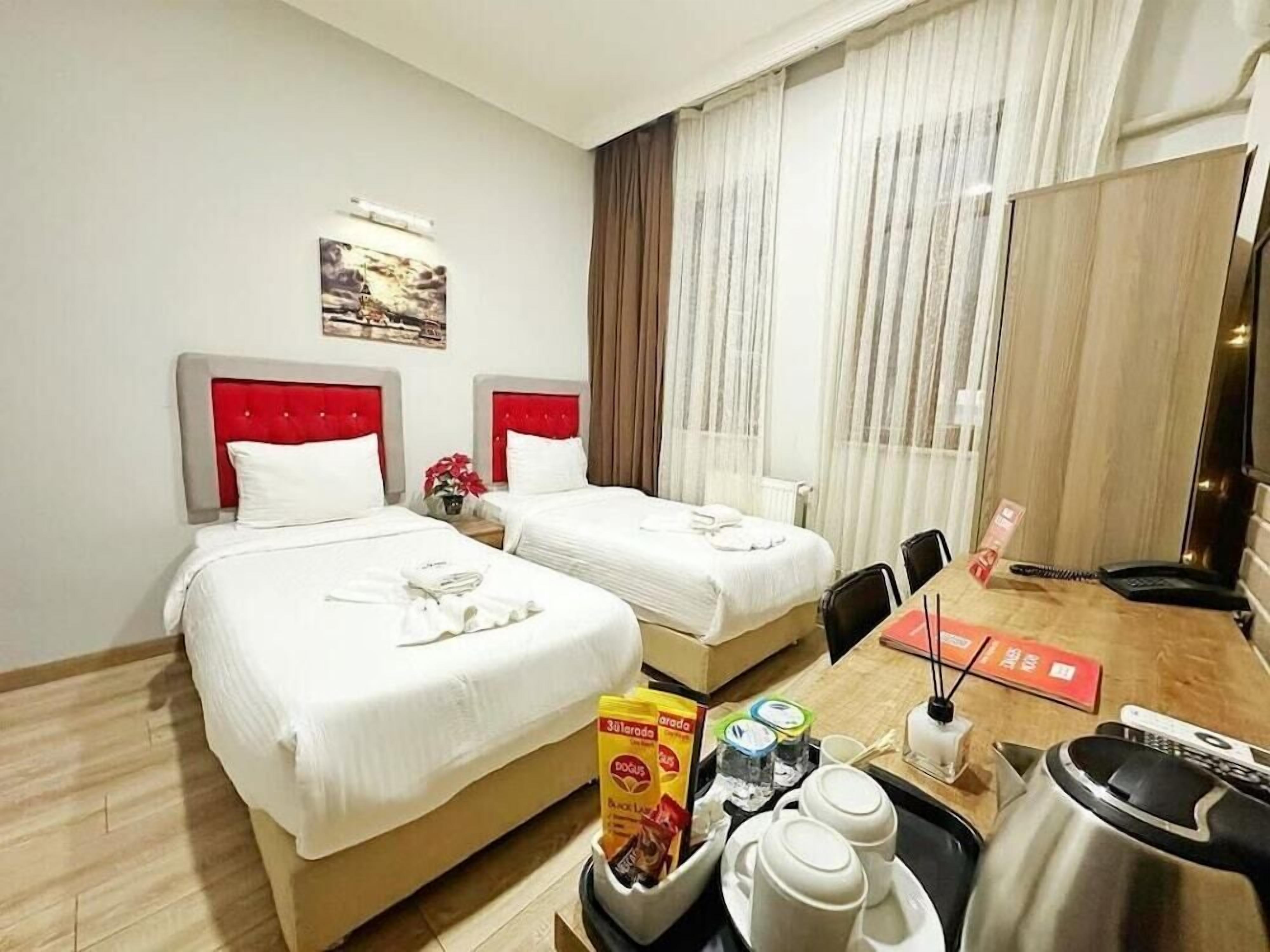 1 quarto, roupas de cama premium, frigobar (abastecido com itens grátis)