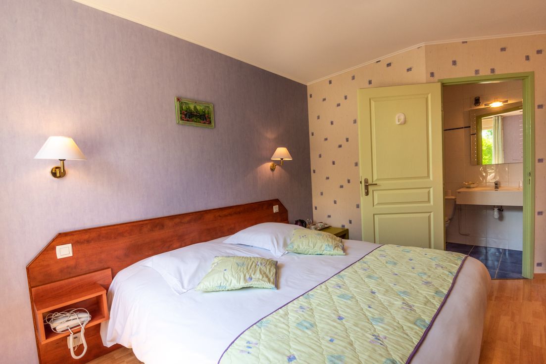 comfort double room, bathtub, garden view | minibar, desk, blackout curtains, free wifi