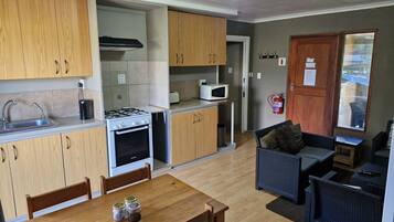 Family Cottage, 2 Bedrooms (Self Catering cottage for 4) | Private kitchenette | Mini-fridge, microwave, cookware/dishes/utensils, freezer