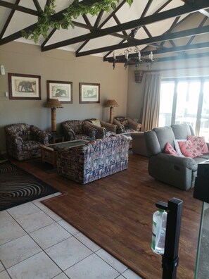 Comfort Room, 1 Bedroom (Eagle) | Living area | 32-inch flat-screen TV with cable channels, TV, fireplace - Ibis Place Guest House (George)