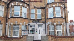 A corner building with a sign for 'Jasmine Guest House.' - The Jasmine Guest House (Bridlington)