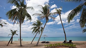 On the beach, sun-loungers, beach umbrellas, beach towels