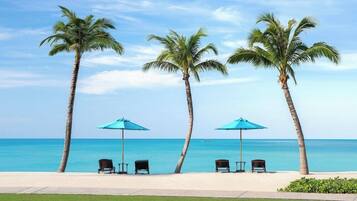 On the beach, sun loungers, beach umbrellas, beach towels