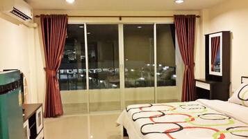Deluxe | Egyptian cotton sheets, pillow-top beds, desk, blackout curtains