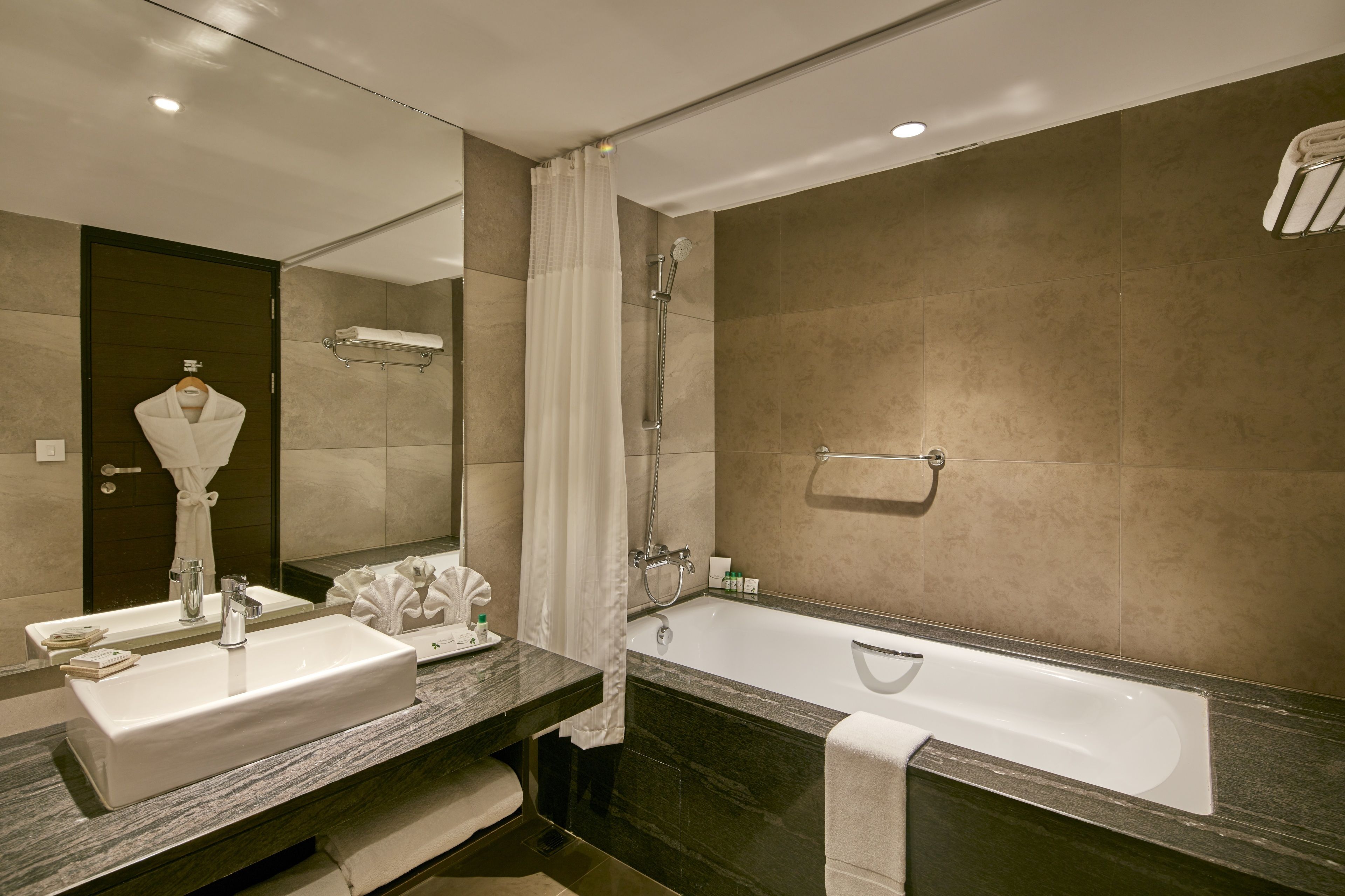 signature suite | bathroom | rainfall showerhead, designer toiletries, hair dryer, bathrobes