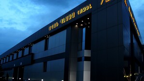 A modern hotel building with illuminated signage and a glass facade. - Avan Plaza (Yerevan)