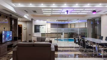 Premium Room, 3 Bedrooms, Private Pool, Garden Area | Living area | 65-inch TV with cable channels