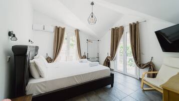 Romantic Suite, 1 King Bed, Partial Sea View | Soundproofing, iron/ironing board, free WiFi, bed sheets