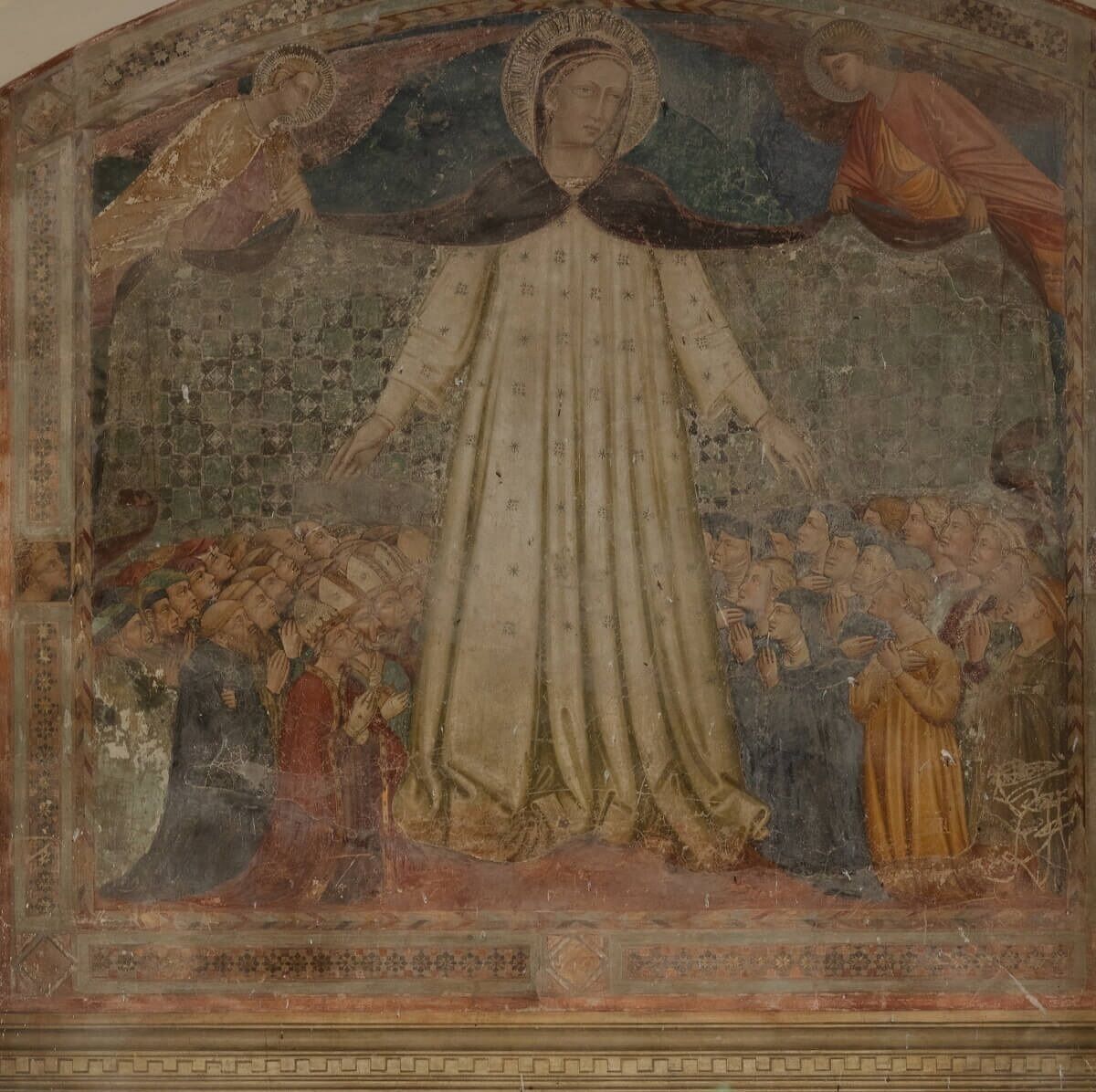 A fresco with a central figure surrounded by smaller figures, set within a geometric architectural framework.