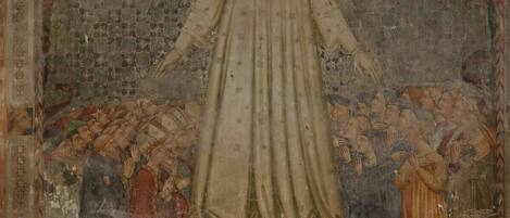 A fresco with a central figure surrounded by smaller figures, set within a geometric architectural framework.