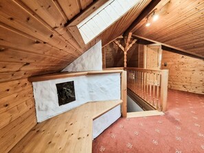 A wooden interior with a staircase leading to an upper level. - Boutique B&B- Landhaus Talblick (Brotterode-Trusetal)
