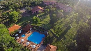 An aerial view of a resort with multiple buildings, a swimming pool, and lush greenery. - Sesc Bonito (Bonito)