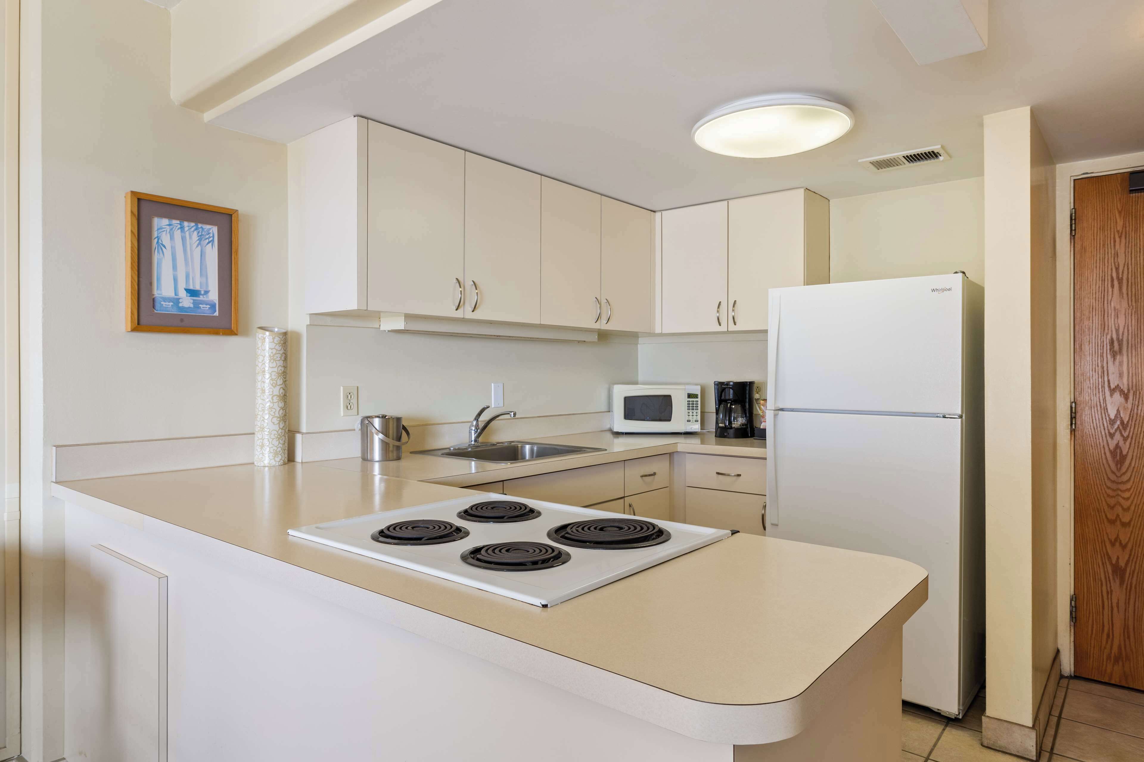 fridge, microwave, coffee/tea maker, cookware/dishes/utensils