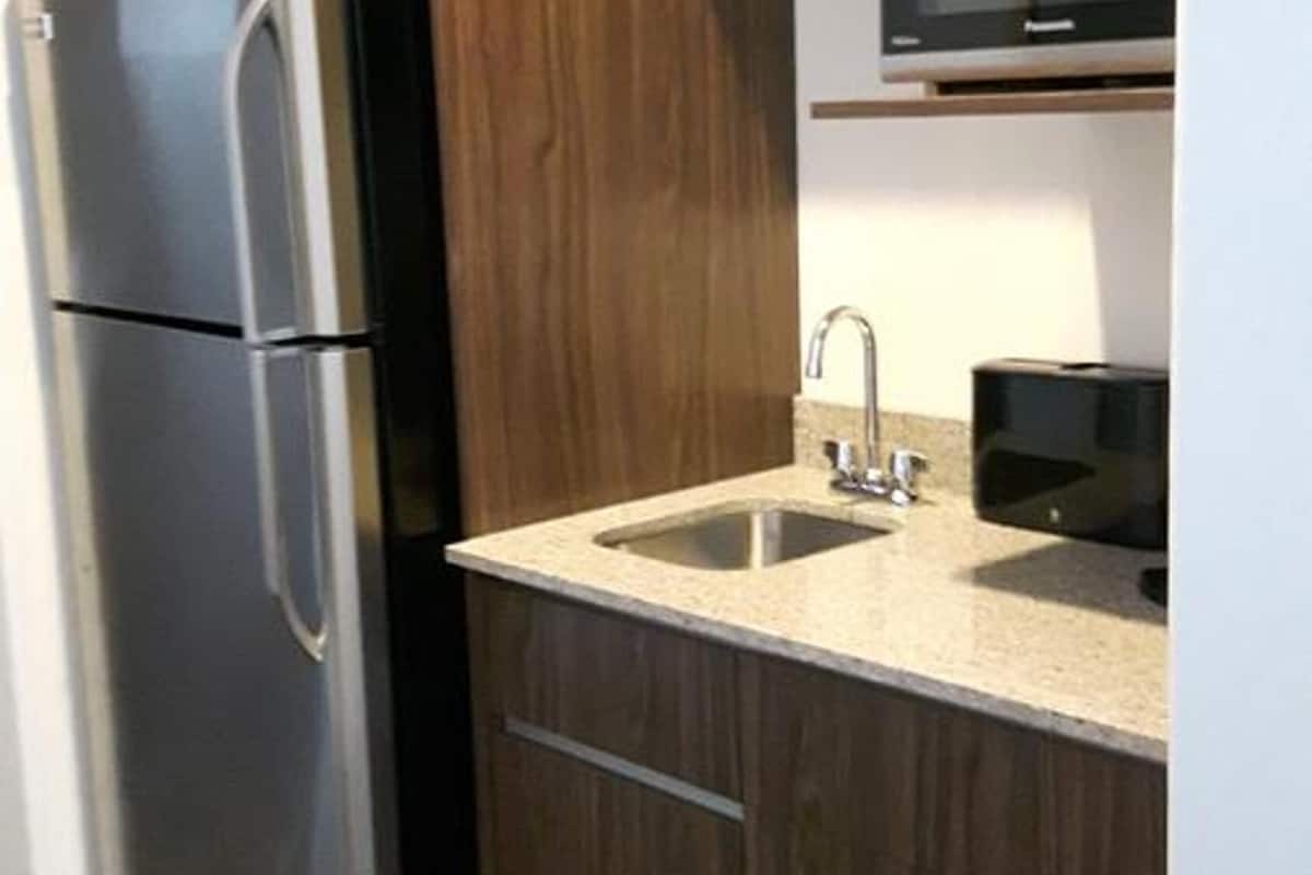 full-sized fridge, microwave, coffee/tea maker, cookware/dishes/utensils